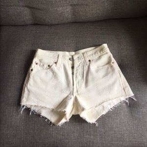 White Levi cutoff denim shorts with button fly